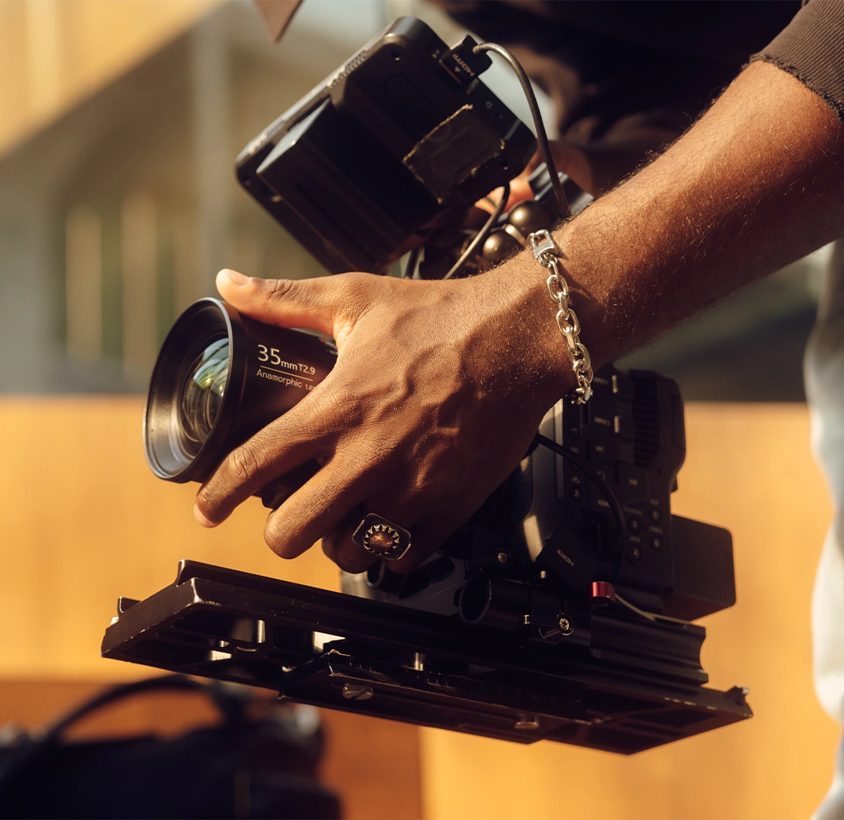 Professional video production camera with cinema lens and stabilizer rig, showcasing filmmaking, cinematography, and commercial content creation equipment.